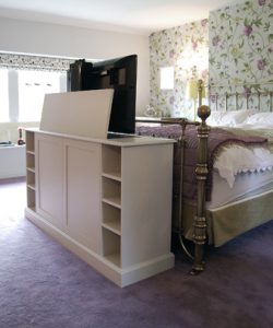 Bespoke pop up TV cabinet for the end of a bed