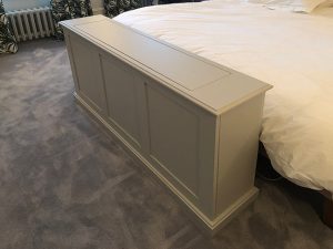 Bed end tv lift cabinet