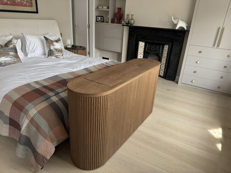 Oak curved tv lift cabinet with fluted panels