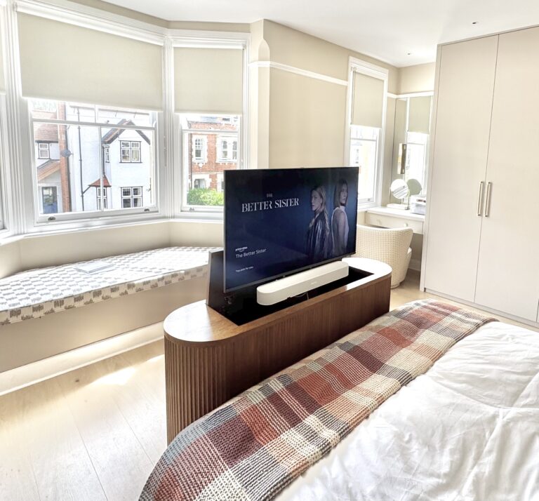 Oak curved tv lift cabinet with fluted panels