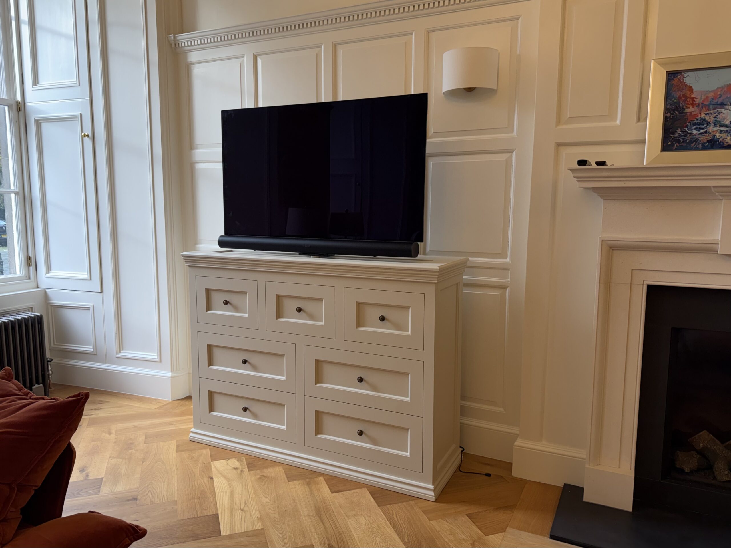 Lounge TV lift cabinet with TV and soundbar and swivel