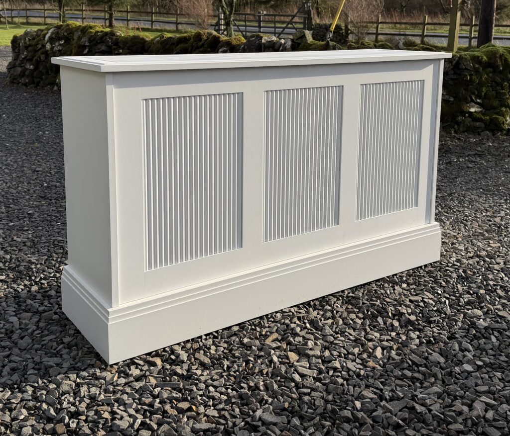 TV lift cabinet with reeded panels